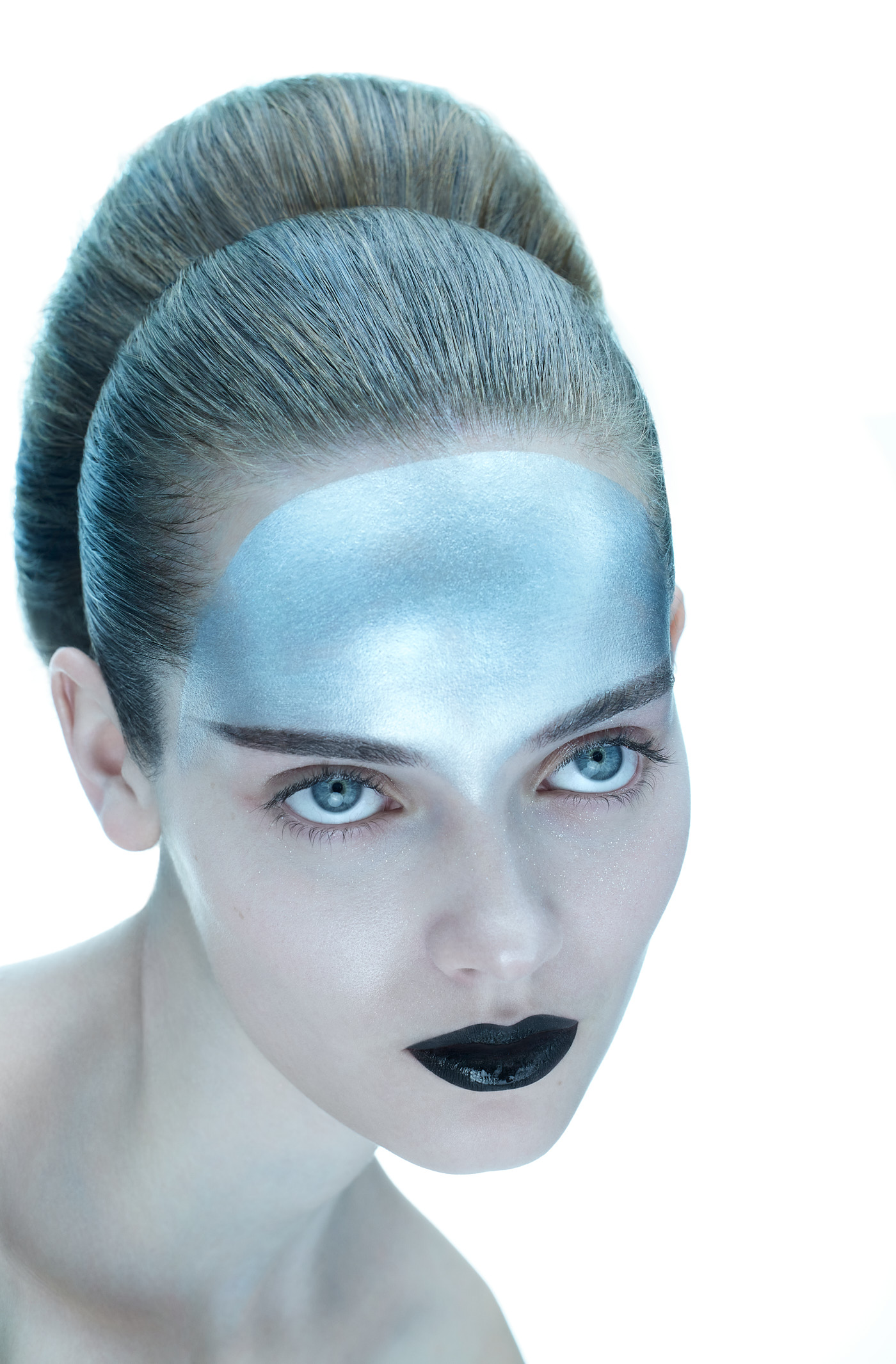 Editorial portrait with futuristic silver and blue makeup, photographed in NYC by Vikram Pathak