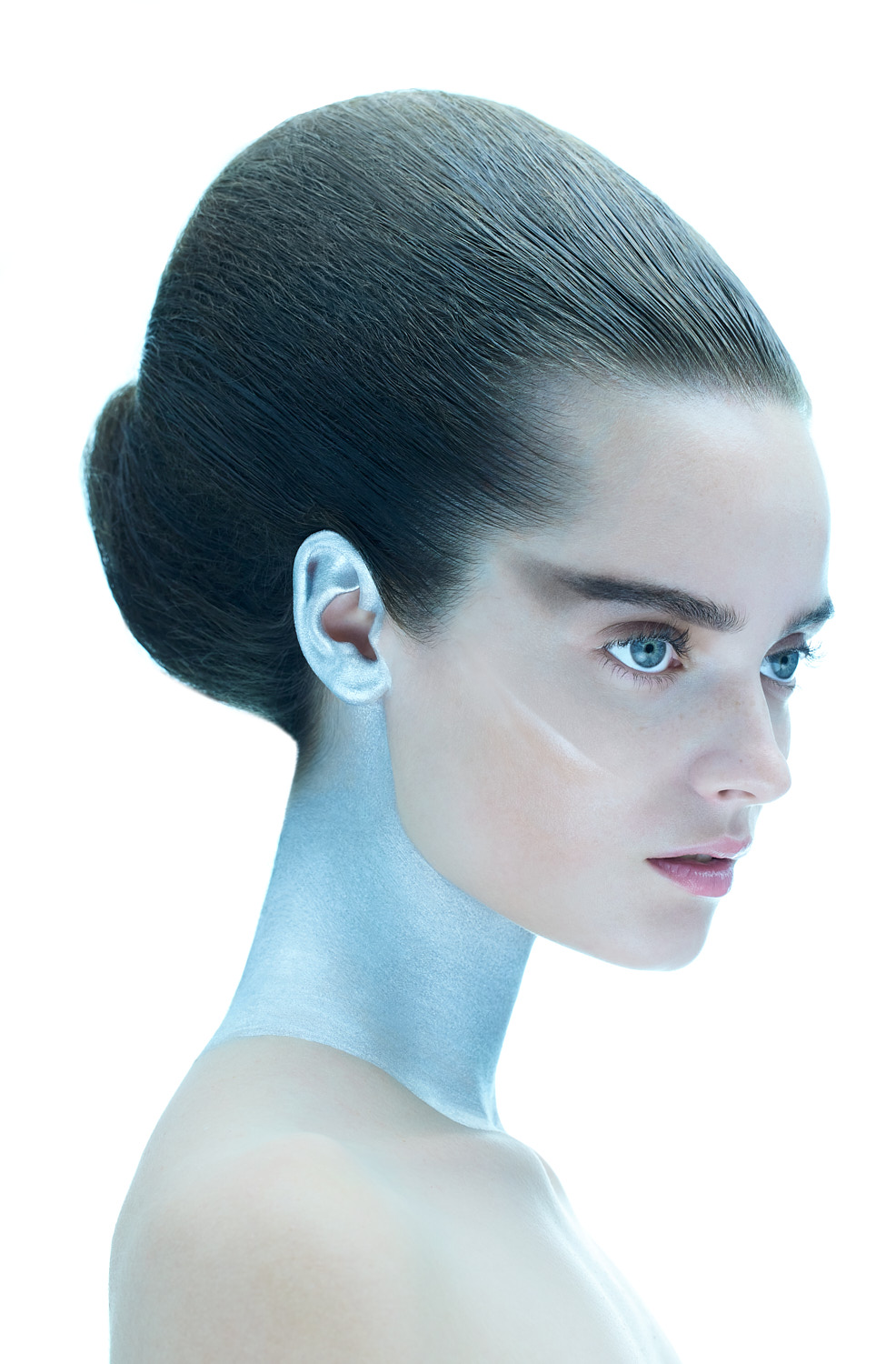 Editorial portrait with futuristic silver and blue makeup, photographed in NYC by Vikram Pathak