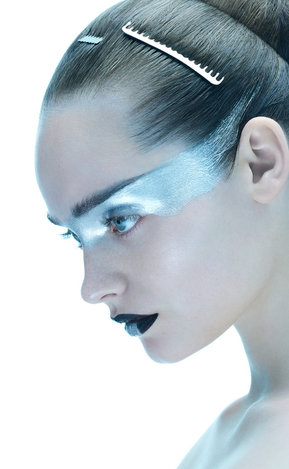 Close-up portrait with shimmering silver face paint, shot by Vikram Pathak, beauty photographer in New York