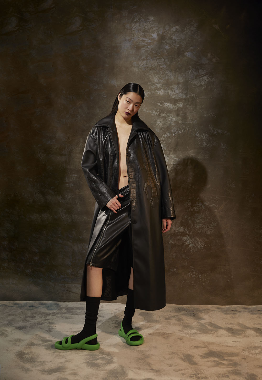 NY Fashion Photographer's - Model in long black leather coat and skirt with neon sandals in studio editorial by Vikram Pathak 