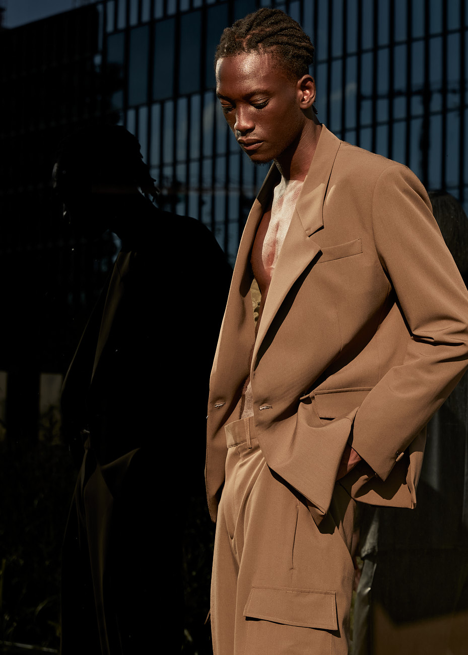 Male model in tan suit styled for a men’s fashion editorial by Vikram Pathak in New York City.