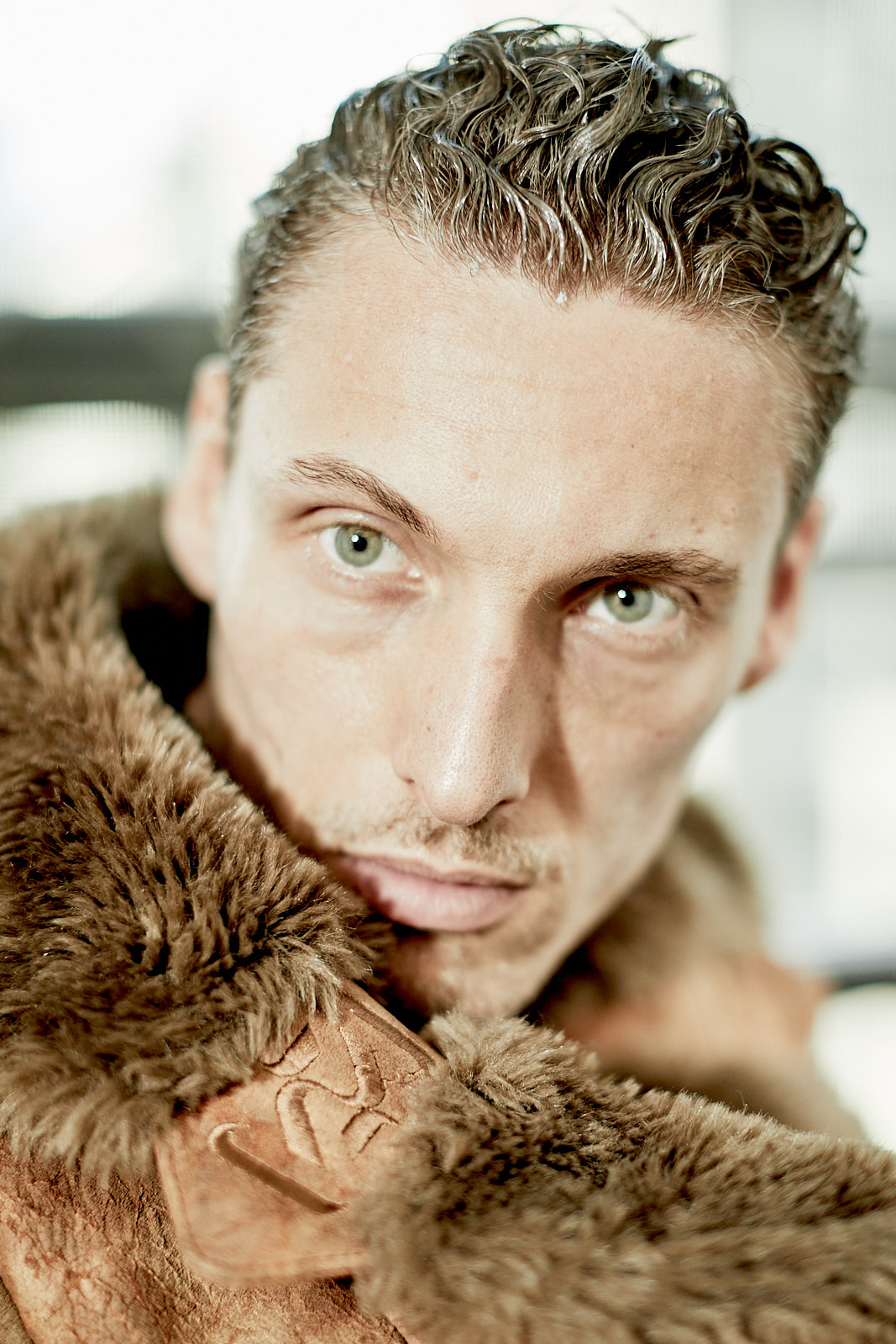 Close-up male model portrait in brown suede fur jacket – Vikram Pathak