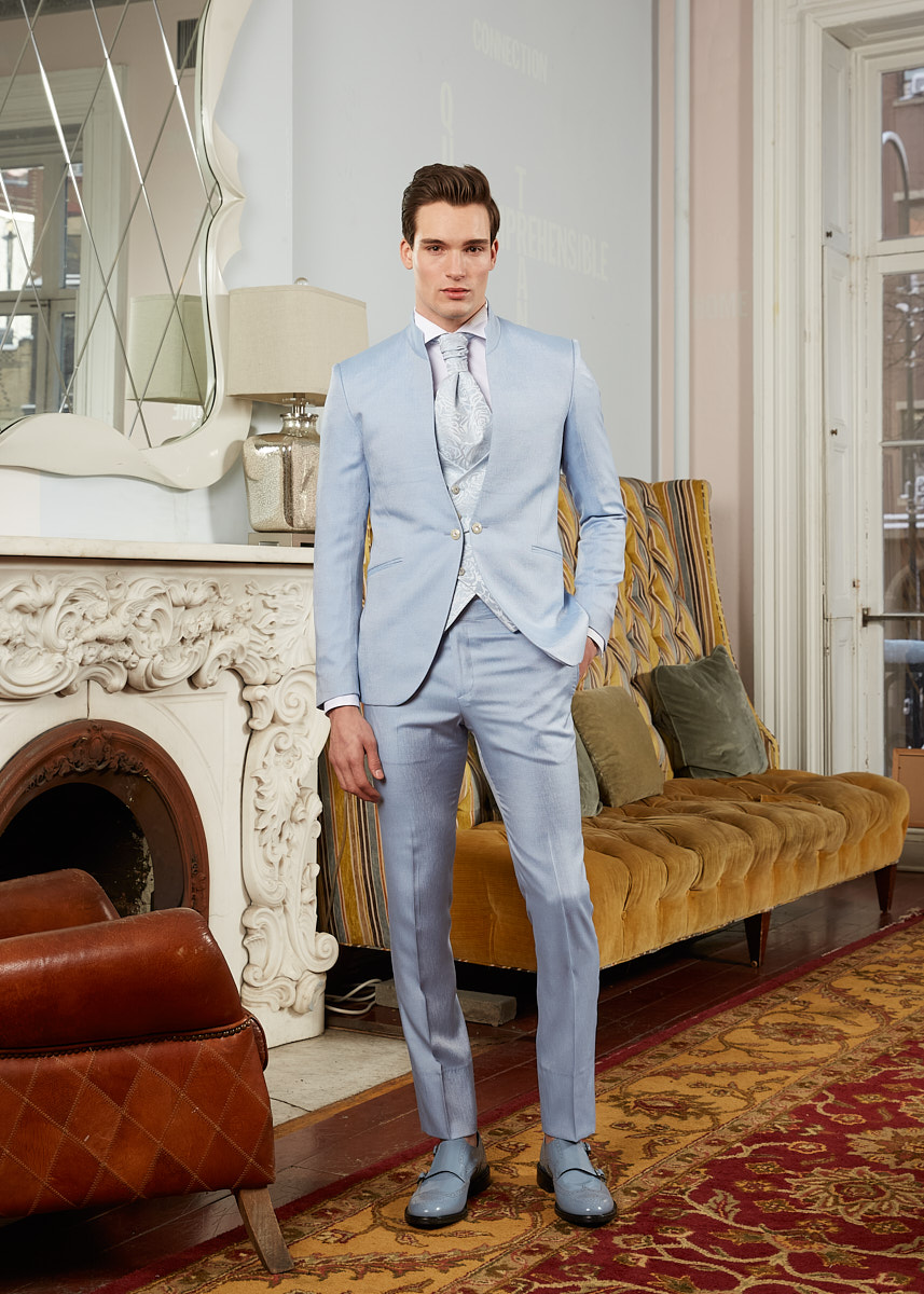 Male model wearing light blue tailored suit photographed in New York City by fashion photographer Vikram Pathak.
