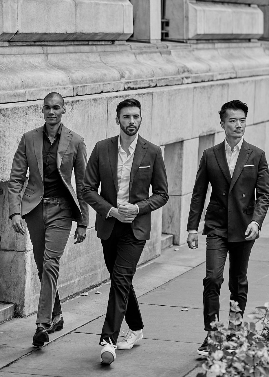 Three male models walking in coordinated suits in NYC by Vikram Pathak, black and white editorial