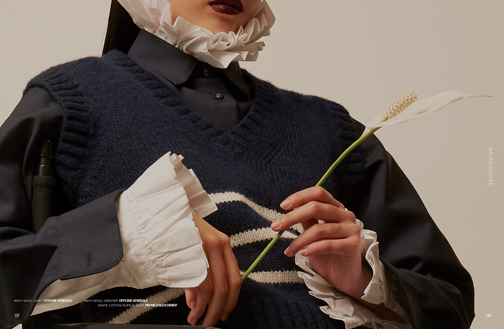 Close-up detail of navy wool sweater and ruffled white cuffs, photographed for Amazing Magazine BLUSH editorial.
