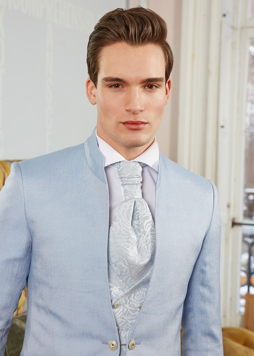 Portrait of male model in blue suit, New York menswear fashion portrait by Vikram Pathak.