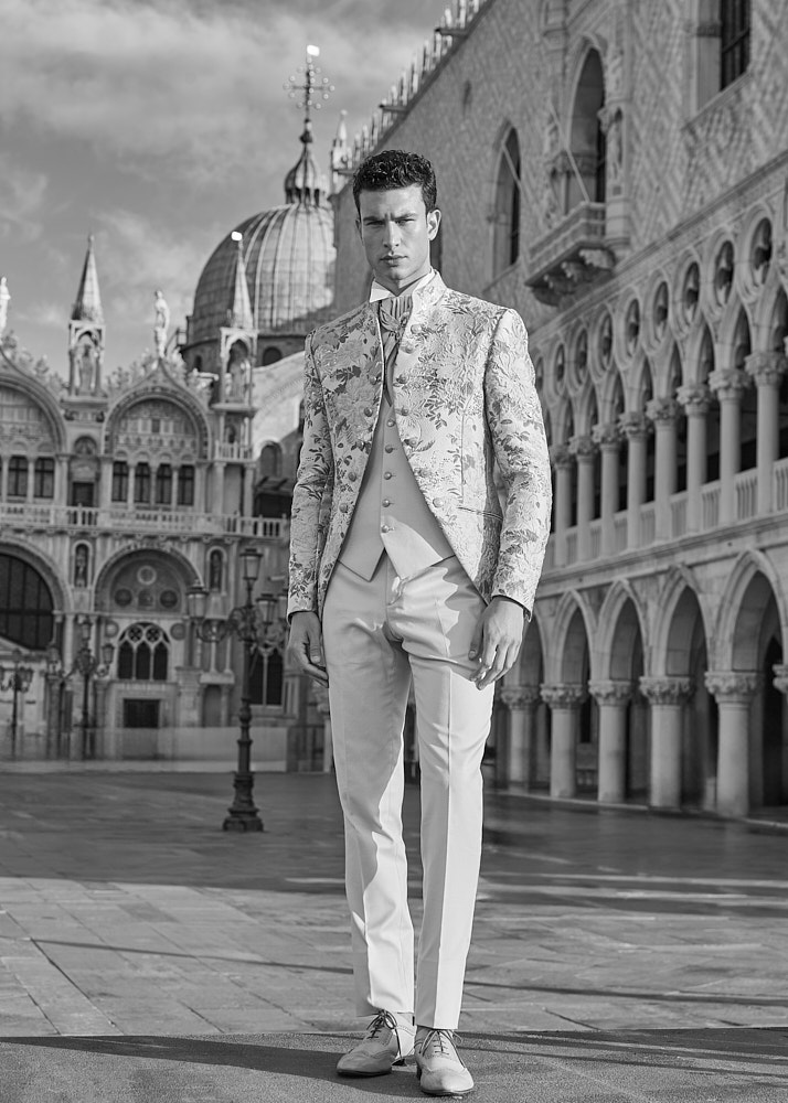 Black and white portrait of male model in tailored suit, shot in Venice by NYC photographer Vikram Pathak