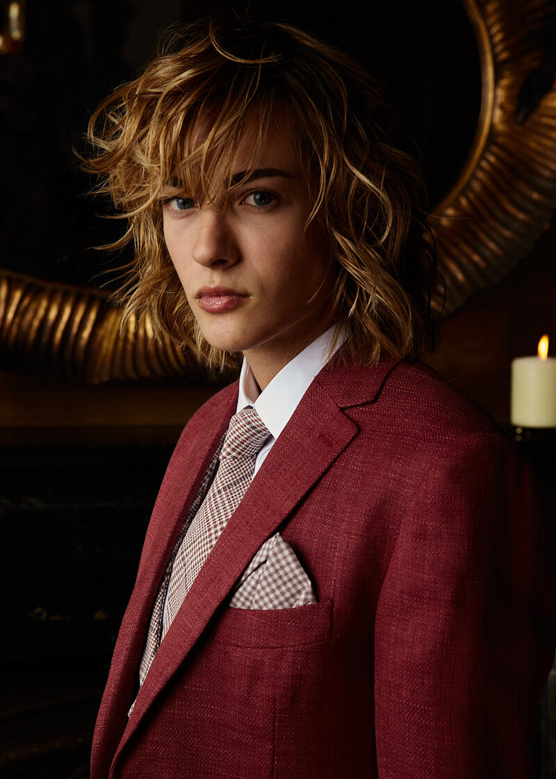 Portrait of male model in red textured suit, New York fashion photography by Vikram Pathak.