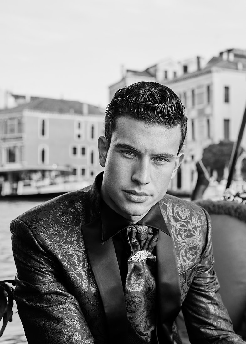 Close-up portrait of man in patterned tuxedo in gondola